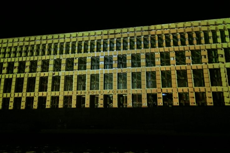 Berlin 1 Berlin's Humboldt Building bathed in projected yellow lights giving a tiled effect to the front wall