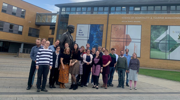 The members of the MeMad consortium posing in front of the University of Surrey