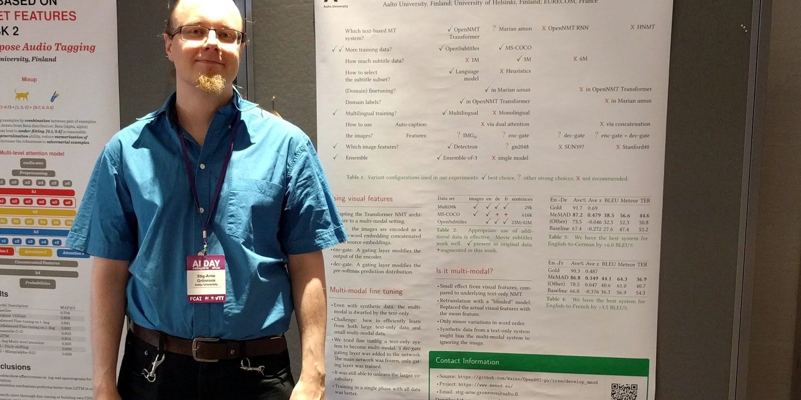 A conference presenter standing by his research poster representing MeMAD.